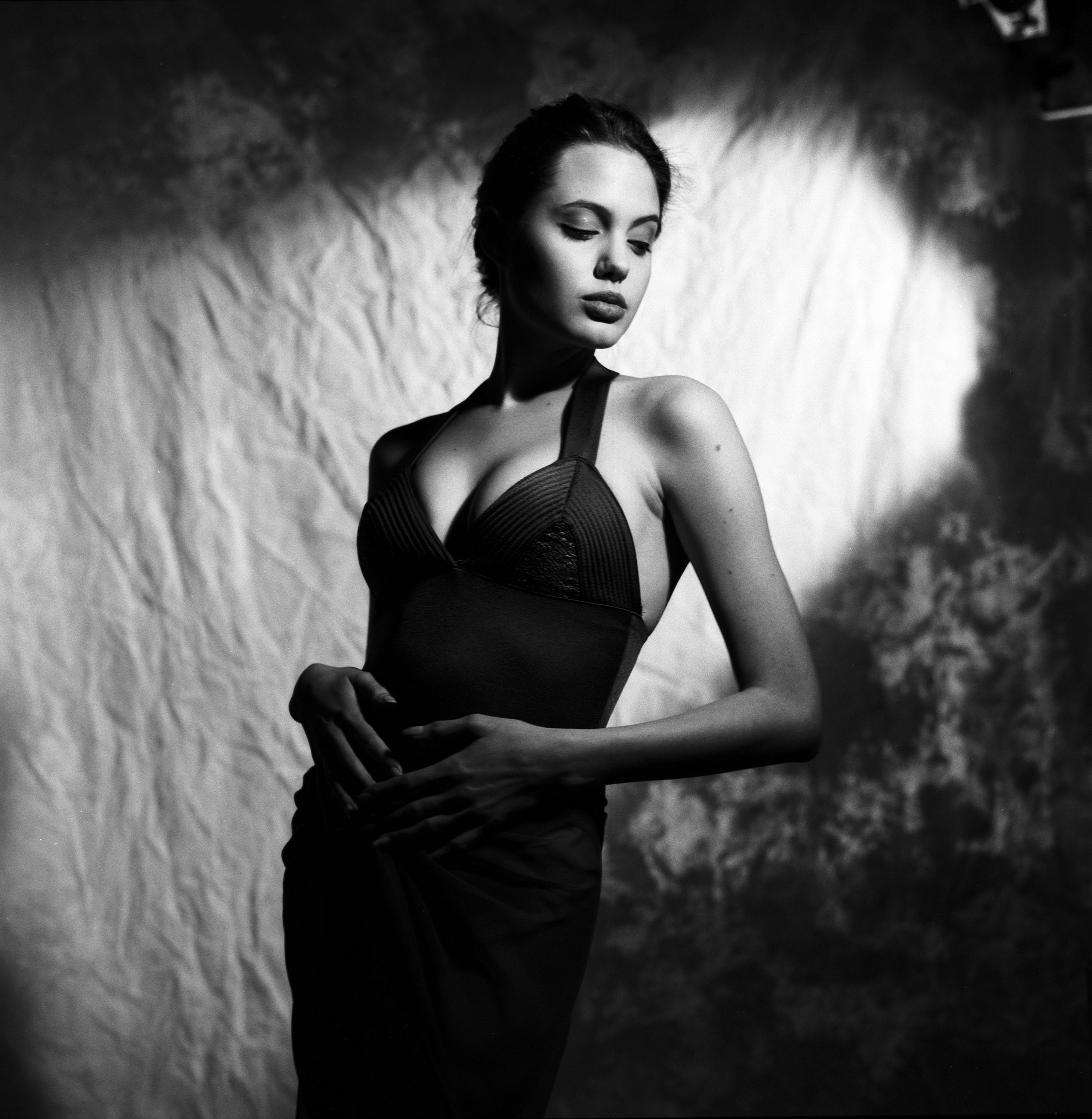 Sixteen year old Angelina Jolie posing seductively for the camera in never-before-seen stills from a lost roll of film.
